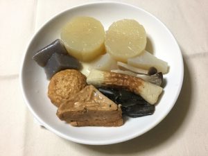 Oden simmered vegetables (daikon radish, konnyaku, eringi oyster mushrooms, konbu (kelp), satsuma-age (savory cakes made from fish paste and vegetables)