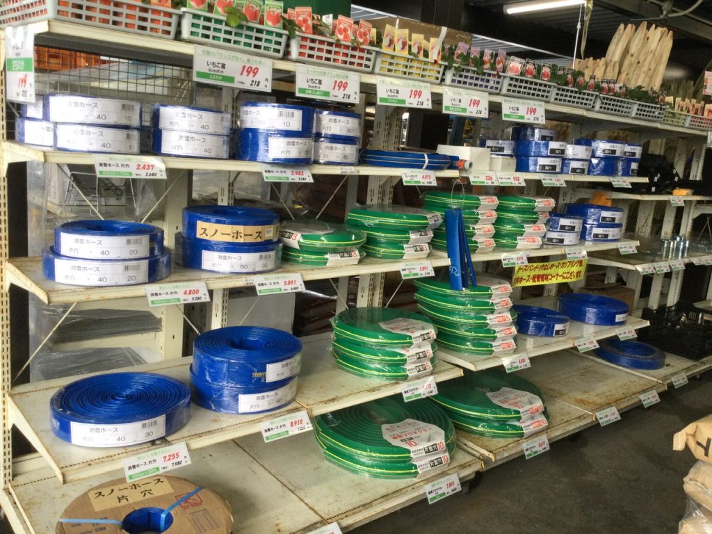 Blue and green snow removal hoses being sold in a store in Minamiuonuma, Niigata, Japan